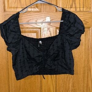 Black crop top with puffed sleeves size L. No stains or tears. Never worn.